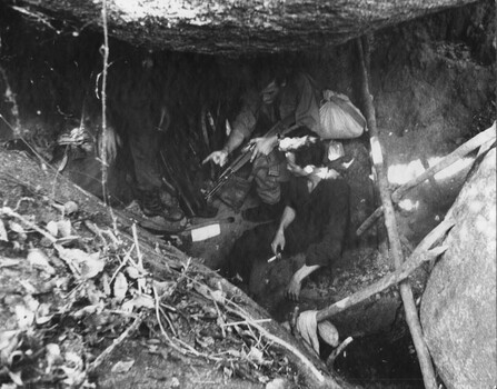 A captured VC with Diggers at the K76A Hospital captured on the Nui May Tao Mountain by 6 RAR/NZ during Operation Marsden. 