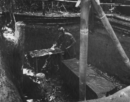 A Digger checks one of eight in ground operating theatres near the wards at the K76A Hospital captured on the Nui May Tao Mountain.