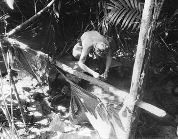 A Digger cleans his mess tin near the wards at the K76A Hospital captured on the Nui May Tao Mountain by 6 RAR/NZ.