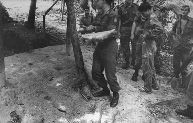 Several soldiers heading towards another undegound bunker in the K76A hospital.