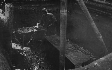 A digger checking out an in ground operating theatre in the K76A hospital.