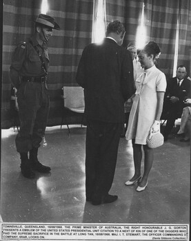 A photograph a Townsville  18/08/1968. The Prime Minister of Australia, the Right Honourable John Gorton presents an emblem of the United States Presidential Unit Citation.