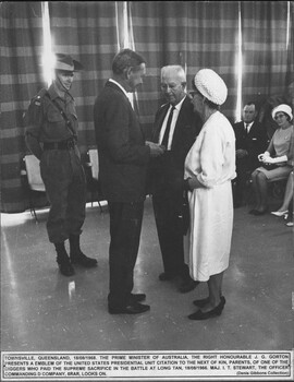 A photograph at Townsville 18/08/1968. The Prime Minister of Australia, The Right Honourable John Gorton presents an emblem of the United States Presidential Unit Citation.