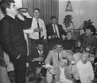 In Townsville, Rock and Roll Stars Little Pattie and Col Joye entertain in the lounge room of a private home.