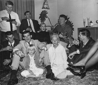 A photograph in Townsville, on 18/08/1968, Rock and Roll stars Little Pattie and Col Joye entertain in the lounge room of a private home. 