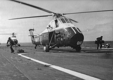 A photograph of Australian Navy Sea King Wessex helicopters prepare to take off the flight deck of the "Vung Tau Ferry" 