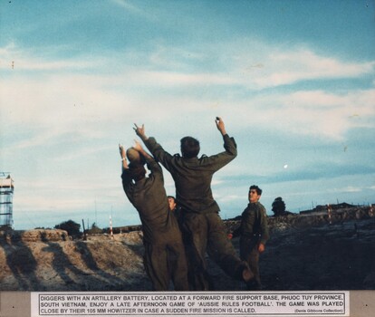 A photograph of Diggers with an Artillery Battery At a Fire Support Base, Phuoc Tuy Province, enjoy a game of Aussie Rules Football. 