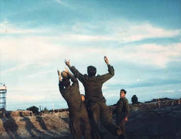 A photograph of Diggers with an Artillery Battery At a Fire Support Base, Phuoc Tuy Province, enjoy a game of Aussie Rules Football. 