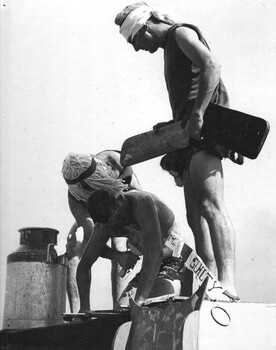 A digger from 9th RAR is found guilty and prepared for his doom by Courtiers of King Neptune during the "crossing of the line" ceremony.