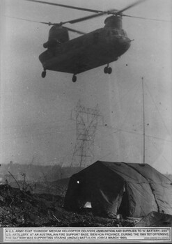 A photograph of a US Army CH47 Chinook helicopter delivering supplies to A Battery 2/35th US Artillery at Base Bien Hoa .