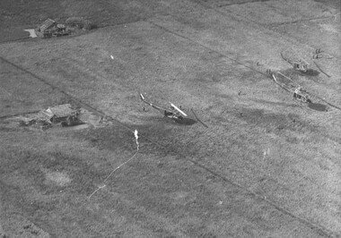 A photograph of helicopters of the 135th Assalt Helicopter Company land Vietnamese rangers in rice paddies, in the Delta.