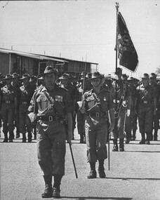 A photograph in Townsville, 8/08/1968. Lt Col Butler. 6RAR leads his battalion in the Trooping of the Colour,. 