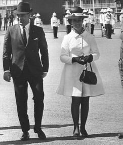 A photograph in Townsville 18/08/1968.  The Honourable Phillip R Lynch and his wife Leah to attend the Trooping of the 6 RAR Regimental Colour. 