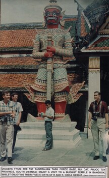 A coloured photograph of Diggers from 1st Australian Task Force Base, Nui Dat, Phuoc Tuy Province, South Vietnam enjoy a visit to a Budhist Temple.