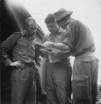 A photograph of Lt Colin Scott DFC, shows Capt Dick Niemela, and Lt Mike Meehan 161, (Indep) Recce Flt.