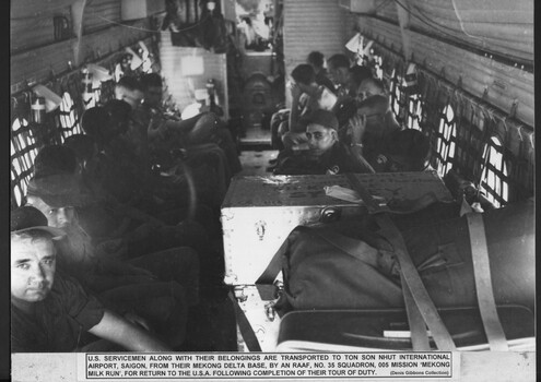 A photograph of US servicemen along with their belongings are transported to Ton Son Nhut International Airport Saigon from their Mekong Delta Base. 