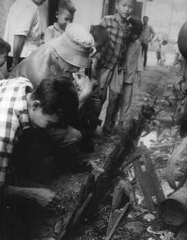 A photograph of Lt Phil Hills,Officer Cammanding the 1st Australian Field Hygiene Unit along with Vu Dien Thien, the Phuoc Tuy Province Health Inspector. 