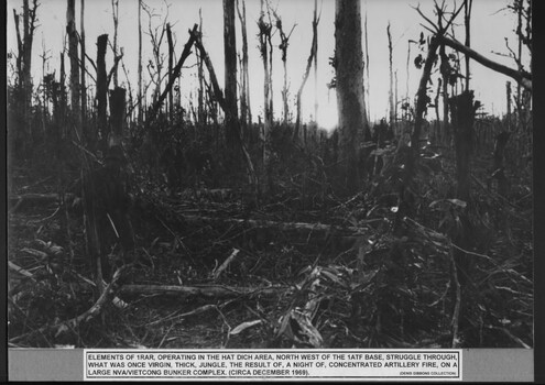 A photograph 1 RAR, operating in the Hat Dich area North West of the 1ATF Base struggle through what was once virgin thick jungle. 