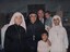 A photograph of Johnny O'Keefe took time out from his concert program to vist the orphans and their caring nuns at the An Phong Orphanage.