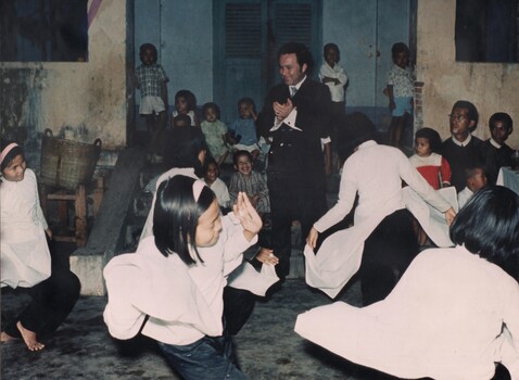 Johnny O'Keefe took time out from his concert party program to visit the orphans and their caring nuns at the An Phong Orphanage,
