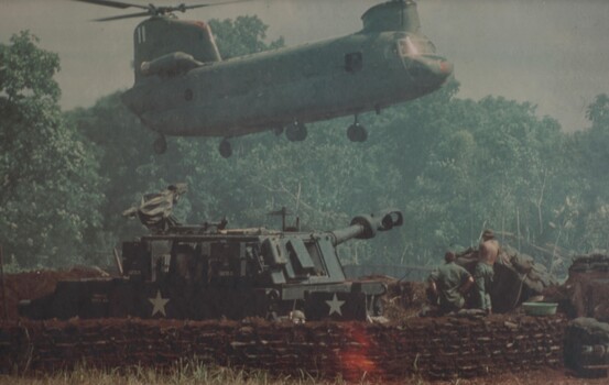 A US Army CH47 Chinook medium helicopter carries ammunition and supplies to A Battery 2/35th US Artillery. 