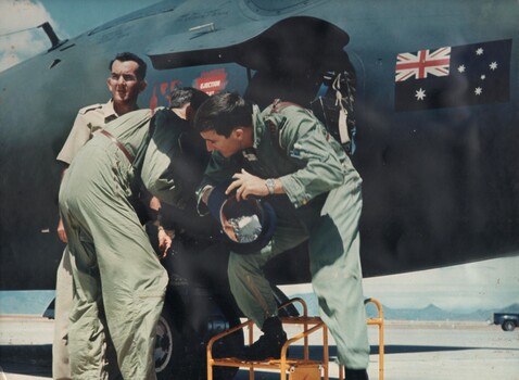 The crew of the first Canberra Jet bomber of the RAAF's No. 2 Sqn to land in Vietnam alight from their aircraft. 