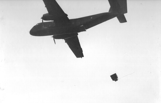A RAAF Caribou aircraft of 35 Sqn attempts to paradrop 105mm amunition to an Australian Fire Support Base. 