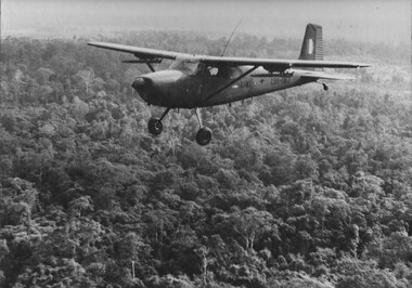 An Australian Army Cessna fixed wing reconnaissance aircraft from 161 (Indep) Recce Flight conducting low level sweeps of the jungle. 