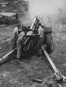 Gunners of 104 Battery RAA at Fire Base "Betty" firing on a high angle against NVA/VietCong sappers.