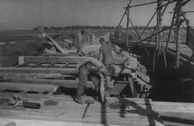 Engineers from 17 Construction Squadron, build a bridge across on of the many creeks and streams which had been destroyed. 
