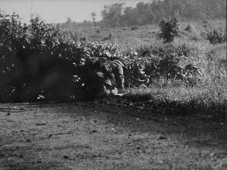 Australian Engineers crawls around a road block constructed by VietCong across the National Highway North West of the Province capital Baria. 
