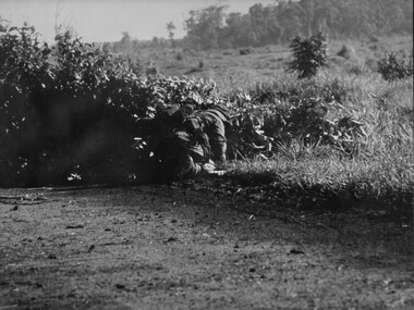 Australian Engineers crawls around a road block constructed by VietCong across the National Highway North West of the Province capital Baria. 
