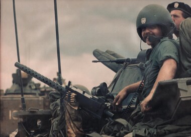 L/Cpl Normie Rowe, one of Australia's top rock stars serving with the Cavalry in Vietnam. Normie is manning a 30 claibre machine gun. 