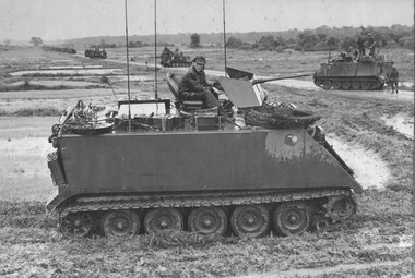 A command Armoured Personnel Carrier of A Squadron, 3rd Cavalry Regiment, 1st ATFstands guard as the American 11th Armoured Cavalry moves through the Province.