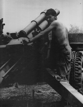 A 104 Battery,  Royal Australian Artillery Gunner, prepares to fire the gun at Fire Base Betty.   