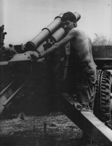 A 104 Battery,  Royal Australian Artillery Gunner, prepares to fire the gun at Fire Base Betty.   
