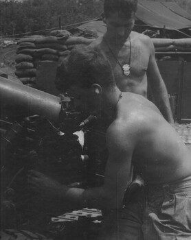 104 Battery Royal Australian Artillery Gunners, make adjustmanetsto ready the gun for firing at Fire Base Betty. 