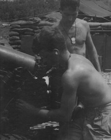 104 Battery Royal Australian Artillery Gunners, make adjustmanetsto ready the gun for firing at Fire Base Betty. 