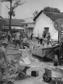 Engineers and Diggers from the 1st Australian Civil Affairs Unit make repairs and refurbish the dispensary and hospital at Hoa Long. 