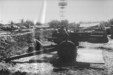 Gunners of 104 Battery, Royal Australian Artillery, at Fire Base Betty carry out maintenance on their gun durung a lull in fighting. 