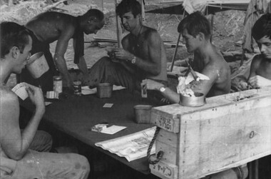 Gnr John Lyall, Sgt Peter Tilbrook, Gnrs Jim Dunn, Leo Adams and Kim Robinson enjoy a game of euchre at Fire Support Base Betty