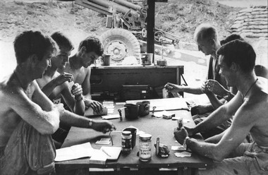 Gnrs Jim Dunn and Leo Adams with their opposite partners enjoy a game of euchre Gnr Kim Robinson tries 'Patience'. 