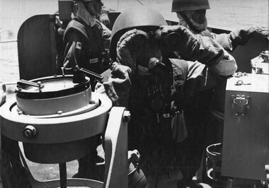 A Gunnery Officer on "a" deck above the bridge on board HMAS Hobart (1967), on the "gunline" during Operation Sea Dragon.  