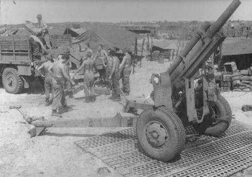 A photograph of a US 105mm towed Howitzer being returned to the 1st Australian Task Force Base , after operations at a Fire Support Base.