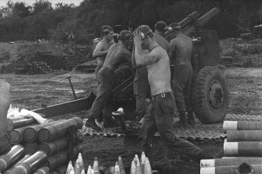 A photograph of Gunners of 101 Battery, 1st Australian Field Regt RAA at Fire Support Base "Baton", east of Nui Dat, Phuoc Tuy Province. 