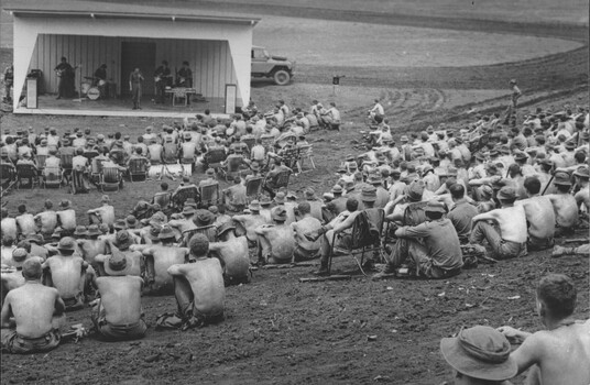 A photograph of musicians at the official Sep-Oct 67 Melbourne Concert Party entertain the Diggers at the Luscombe Bowl at 1st ATF, Nui Dat.