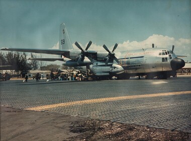 A photograph of RAAF C130 Hercules transport, operating between Australia and Vietnam and carrying passengers and supplies. 