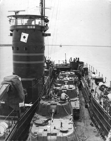 A photograph of the Landing Craft the Vernon Sturdie or 'The Ace of Spades' as it makes its way up the Mekong River. 