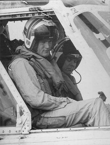 A photograph of two Navy pilots from the Sea King anti-submarine helicopter on board "the Vung Tau Ferry" HMAS Sydney. 