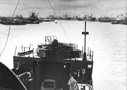 A photograph of the Australian Army Landing Craft 'Vernon Sturdie'  moving into the congested Saigon-Long Binh dock to unload American tanks. 